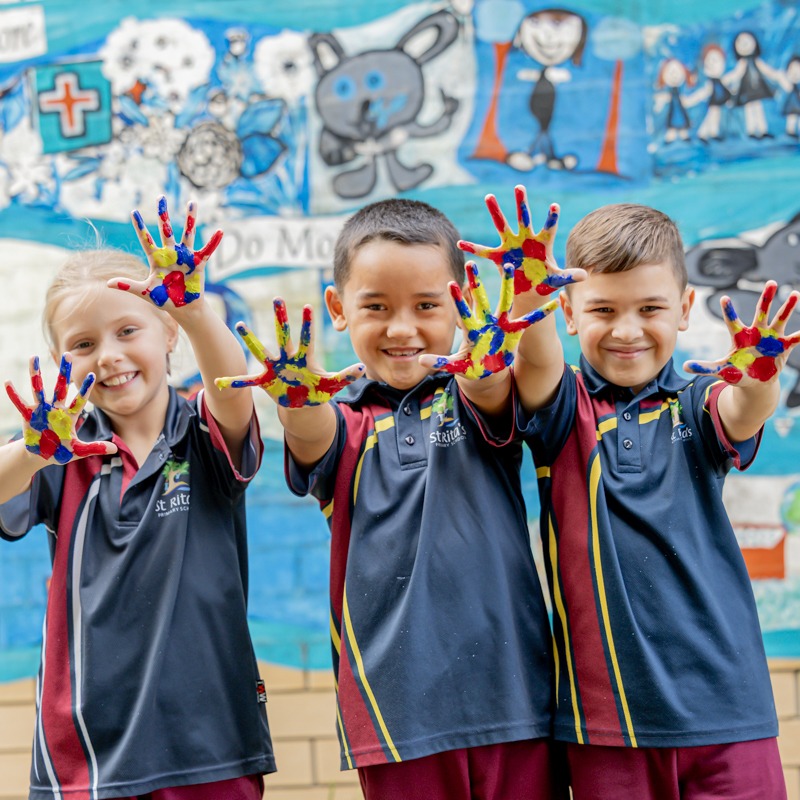 Students displaying painted hands highlighting creativity self expression and joyful learning experiences