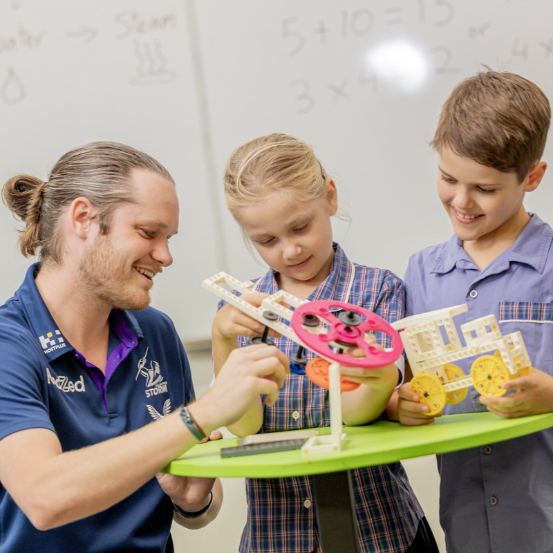 Student participating in an activity with a teacher